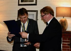 Chris receives the award from Club President Mike Slocombe